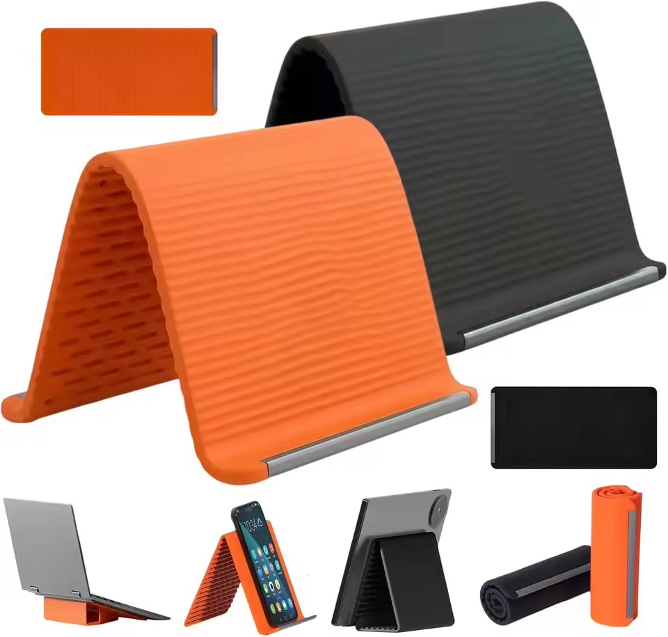Desk Accessories - 怠惰な人でも使える、持ち運び可能なスマートフォンスタンド。シリコン製で、デスクトップやタブレット、ノートパソコンに設置可能。クリエイティブで柔軟性があり、折りたたんで変形させられるので、旅行にも便利なアクセサリー。